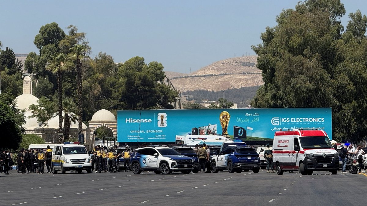 Emergency vehicles and personnel at the site where explosive devices blew up near a hotel where French President Emmanuel Macron was meant to be staying, in Damascus, Syria, July 7, 2026. (Reuters Photo)