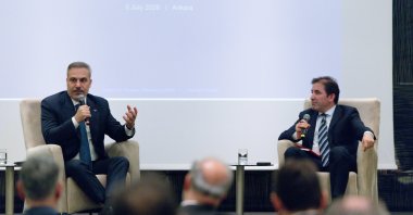 Foreign Minister Hakan Fidan (L) speaks at an event organized by Chatham House and the Center for Strategic Research, Ankara, Türkiye, July 6, 2026. (AA Photo)