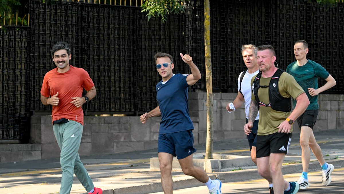 French President Emmanuel Macron gestures as he is running, Ankara, Türkiye, July 8, 2026. (AA Photo)