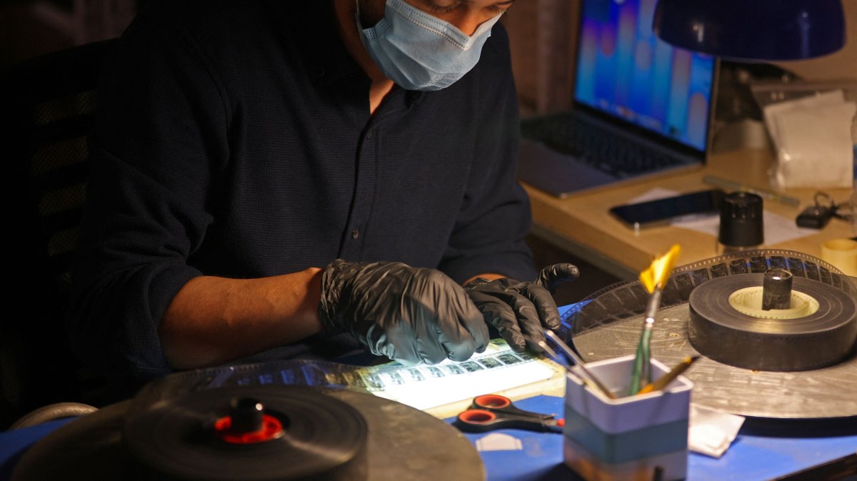 Director Ahmed al-Samar restores a film reel at the National Center for Archives and Iraqi Memory, Baghdad, Iraq, June 14, 2026. (AFP Photo)