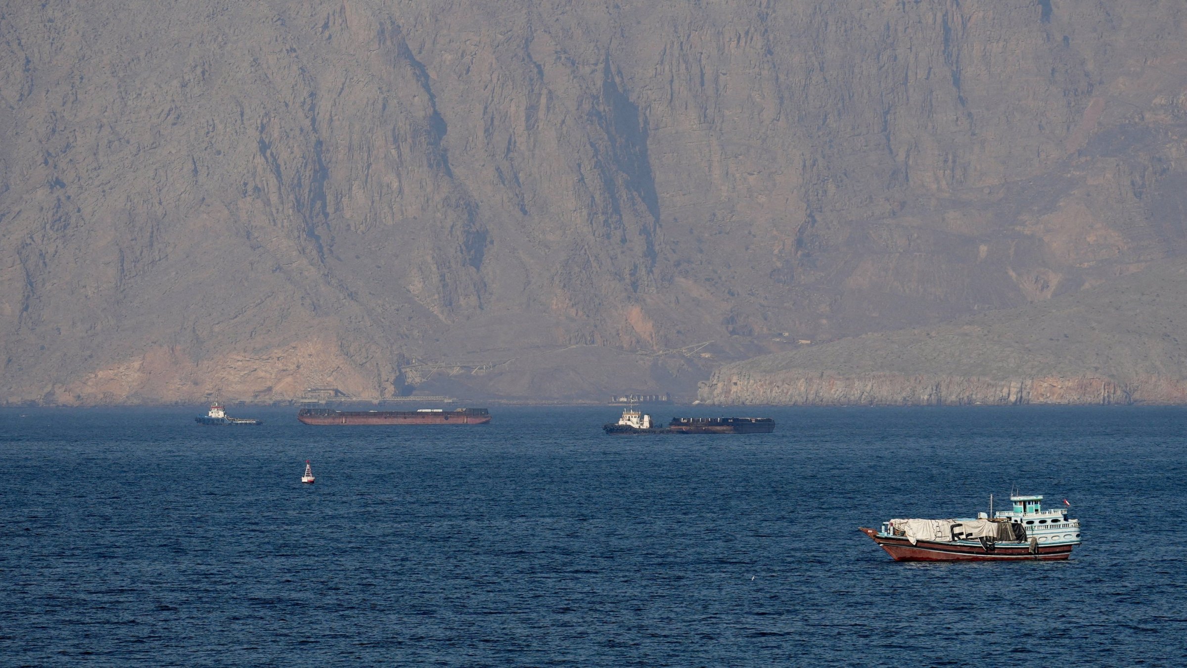 Ships and tankers in the Strait of Hormuz off the coast of Musandam, Oman, April 18, 2026. (Reuters Photo)