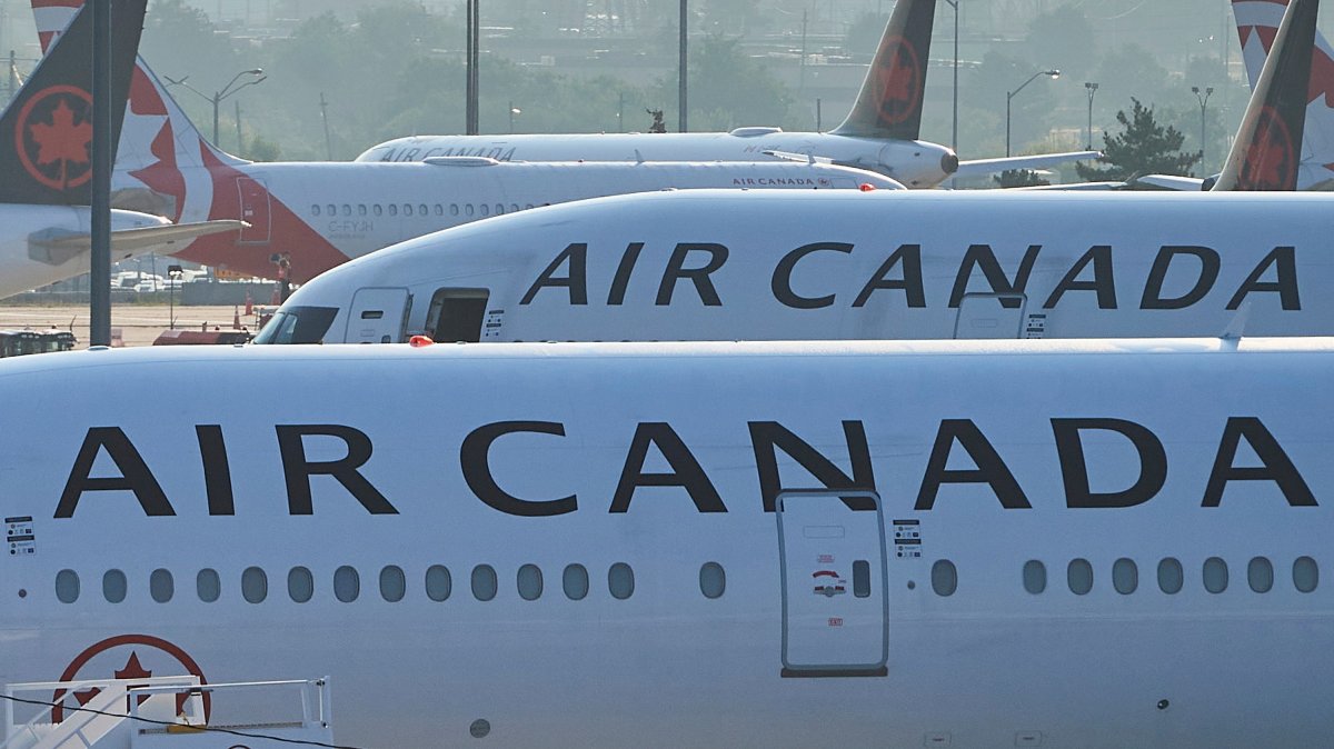 Air Canada planes sit on the runway at Pearson International Airport in Toronto, Canada, Aug. 16, 2025. (AP Photo)