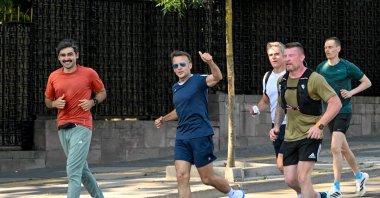 French President Emmanuel Macron gestures as he is running, Ankara, Türkiye, July 8, 2026. (AA Photo)