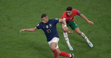 France's Kylian Mbappe (L) and Morocco's Achraf Hakimi in action during the 2022 FIFA World Cup semifinal match at Al Bayt Stadium, Al Khor, Qatar, Dec. 14, 2022. (Getty Images Photo)