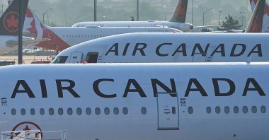Air Canada planes sit on the runway at Pearson International Airport in Toronto, Canada, Aug. 16, 2025. (AP Photo)