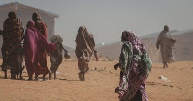 Sudanese refugee women walk at the Tulum refugee camp, amid ongoing conflict in Sudan between the paramilitary Rapid Support Forces (RSF) and the Sudanese army, in Wadi Fira province, eastern Chad, Nov. 30, 2025. (Reuters Photo)