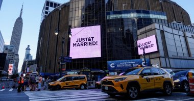 Screens display a message referencing singer Taylor Swift and National Football League (NFL) player Travis Kelce outside Madison Square Garden, the venue for their reported wedding celebrations, in New York, U.S., July 3, 2026. (Reuters Photo)