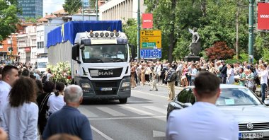 Residents pay their respects near the truck carrying the remains of the victims of the 1995 Srebrenica genocide, two days before its 31st anniversary, Sarajevo, Bosnia-Herzegovina, July 9, 2026. (AFP Photo)