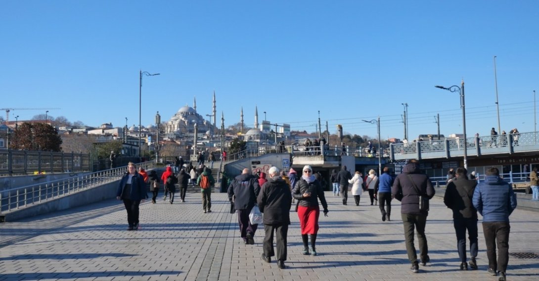 People walk along the waterfront in the Eminönü district, Istanbul, Türkiye, Nov. 23, 2025. (Shutterstock Photo)