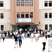 Students enter a school before taking the High School Transition System (LGS) entrance exam, Izmir, Türkiye, June 13, 2026. (AA Photo) 