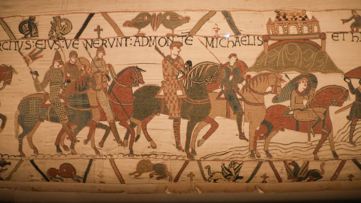A scene on the Bayeux Tapestry depicts horsemen and Mont Saint-Michel, believed to be one of the earliest known visual representations of the French landmark, Bayeux, France, Aug. 29, 2025. (Reuters Photo)