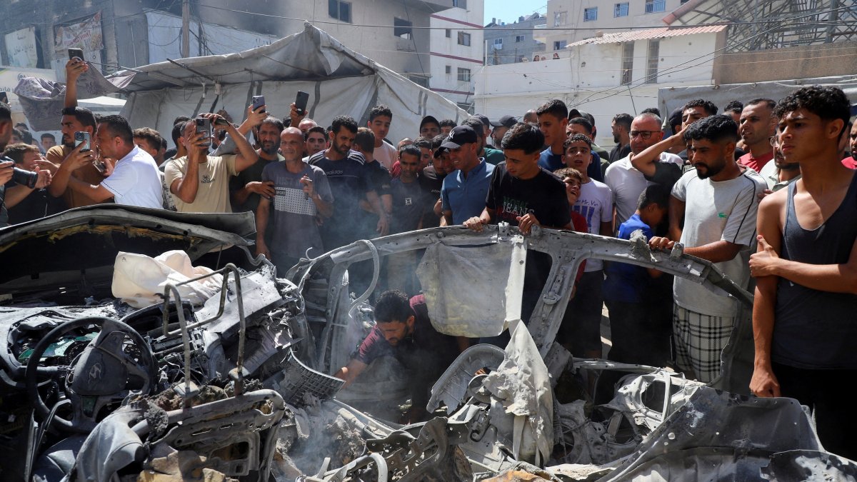 Palestinians inspect the site of an Israeli strike on a vehicle, Gaza City, Palestine, July 9, 2026. (Reuters Photo)