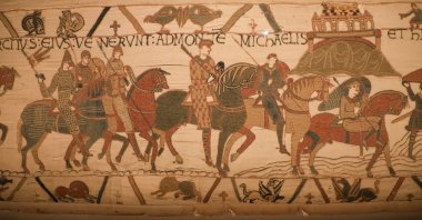 A scene on the Bayeux Tapestry depicts horsemen and Mont Saint-Michel, believed to be one of the earliest known visual representations of the French landmark, Bayeux, France, Aug. 29, 2025. (Reuters Photo)