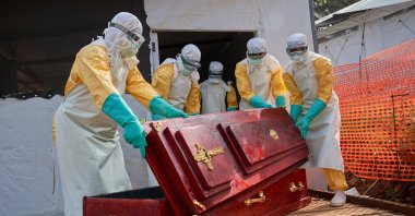 Staff carry a coffin for a victim of Ebola at the hospital, Mongbwalu, Ituri, DRC, June 26, 2026. (EPA Photo)