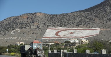 A massive Turkish Republic of North Cyprus (TRNC) flag adorns a mountainside, Taşkent, TRNC, March 6, 2017. (Getty Images Photo)