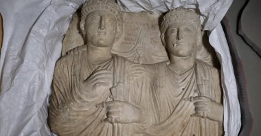 Palmyrene funerary reliefs that once adorned the walls of tombs and date to the second and third centuries are displayed after Syrian authorities unveiled antiquities returned from France at the National Museum, Damascus, Syria, July 8, 2026. (AP Photo)
