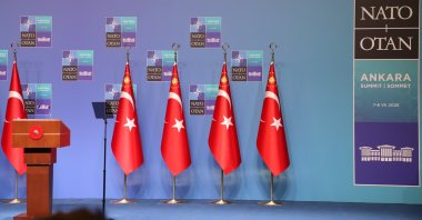 Turkish flags stand beside the podium at the NATO leaders summit venue in Ankara, Türkiye, July 8, 2026. (Daily Sabah Photo)