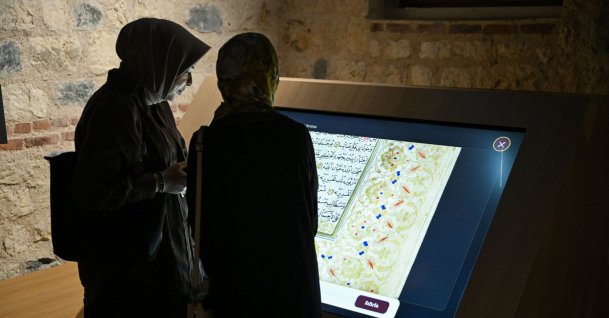 Visitors examine digitally reproduced manuscripts during an exhibition organized by the Presidency of the Manuscripts Institution of Türkiye (TÜYEK) at the Rami Library, Istanbul, Türkiye, June 26, 2026. (AA Photo)