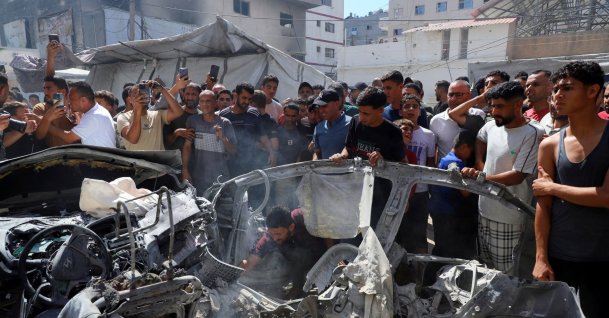 Palestinians inspect the site of an Israeli strike on a vehicle, Gaza City, Palestine, July 9, 2026. (Reuters Photo)