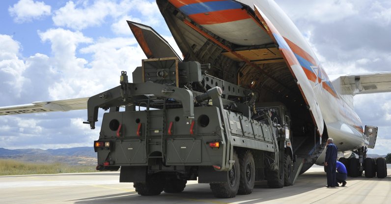 Military vehicles and equipment, parts of the S-400 air defense systems, are unloaded from a Russian transport aircraft at a military airport, Ankara, Türkiye, July 12, 2019. (AP Photo)