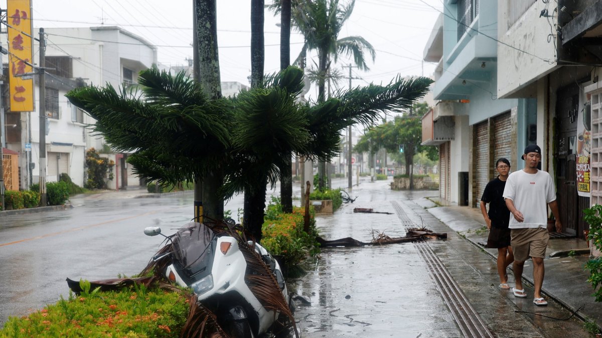 People make their way along a street after Typhoon Bavi passed through, Ishigaki, Japan, July 11, 2026. (Reuters Photo)