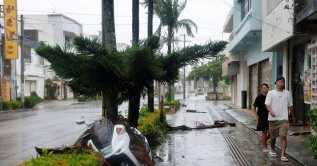 People make their way along a street after Typhoon Bavi passed through, Ishigaki, Japan, July 11, 2026. (Reuters Photo)