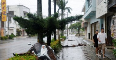 People make their way along a street after Typhoon Bavi passed through, Ishigaki, Japan, July 11, 2026. (Reuters Photo)