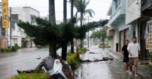 People make their way along a street after Typhoon Bavi passed through, Ishigaki, Japan, July 11, 2026. (Reuters Photo)