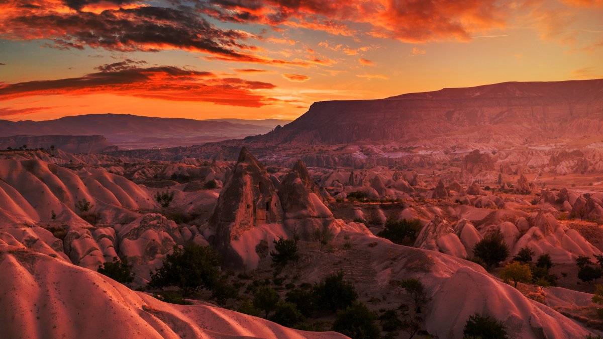 The rocky landscape of Cappadocia at sunset, Türkiye. (Shutterstock Photo)