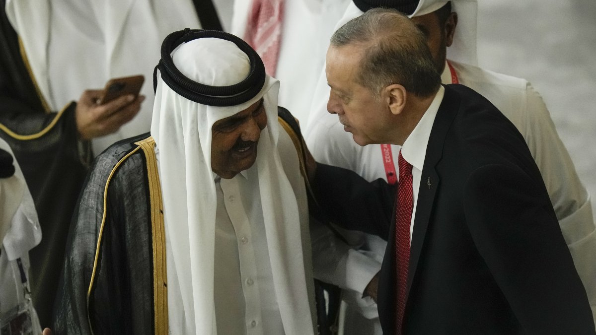 Former Emir of Qatar Sheikh Hamad bin Khalifa Al Thani (L) and President Recep Tayyip Erdoğan greet each other before the start of the World Cup, Al Khor, Qatar, Nov. 20, 2022. (AP Photo)