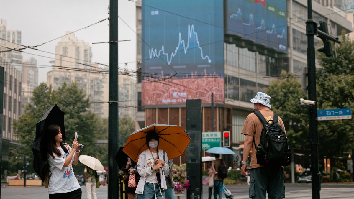 People walk on a street, Shanghai, China, June 15, 2026. (EPA Photo)