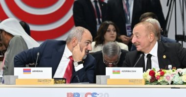Armenian Prime Minister Nikol Pashinyan (L) and Azerbaijani President Ilham Aliyev speak during the BRICS summit in Kazan, Tatarstan, Russia, Oct. 22, 2024. (Shutterstock Photo)