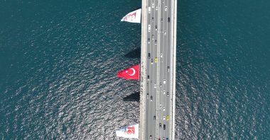 Drone footage shows a Turkish flag displayed on the July 15 Martyrs Bridge ahead of the 10th anniversary of the failed coup attempt, Istanbul, Türkiye, July 4, 2026. (AA Photo) 