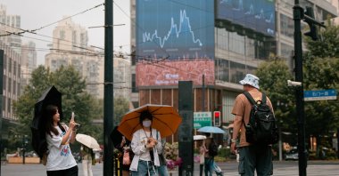 People walk on a street, Shanghai, China, June 15, 2026. (EPA Photo)