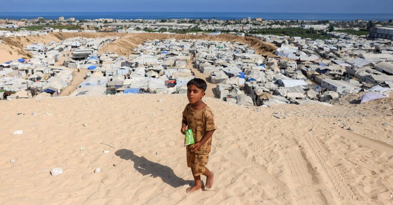 A boy walks near camps for people displaced by war in Khan Younis in the southern Gaza Strip, Palestine, July 11, 2026. (AFP Photo)