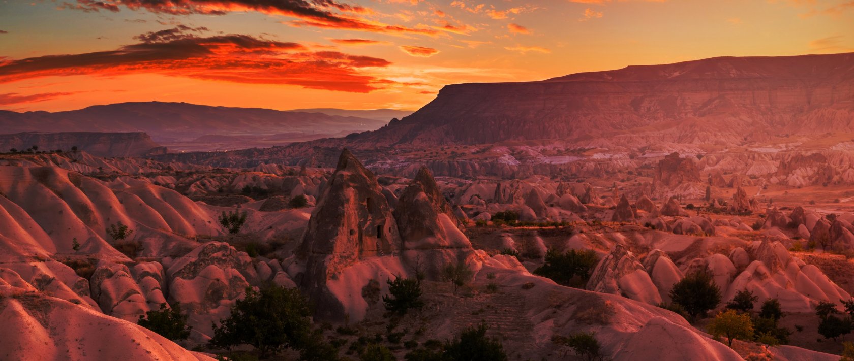The rocky landscape of Cappadocia at sunset, Türkiye. (Shutterstock Photo)