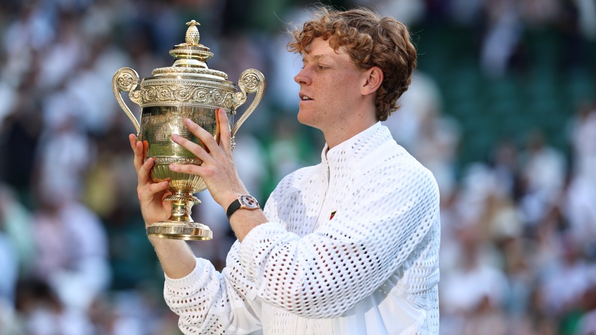 Italy's Jannik Sinner celebrates with the trophy after winning the Wimbledon Men's Singles final against Germany's Alexander Zverev, London, Britain, July 12, 2026. (EPA Photo)