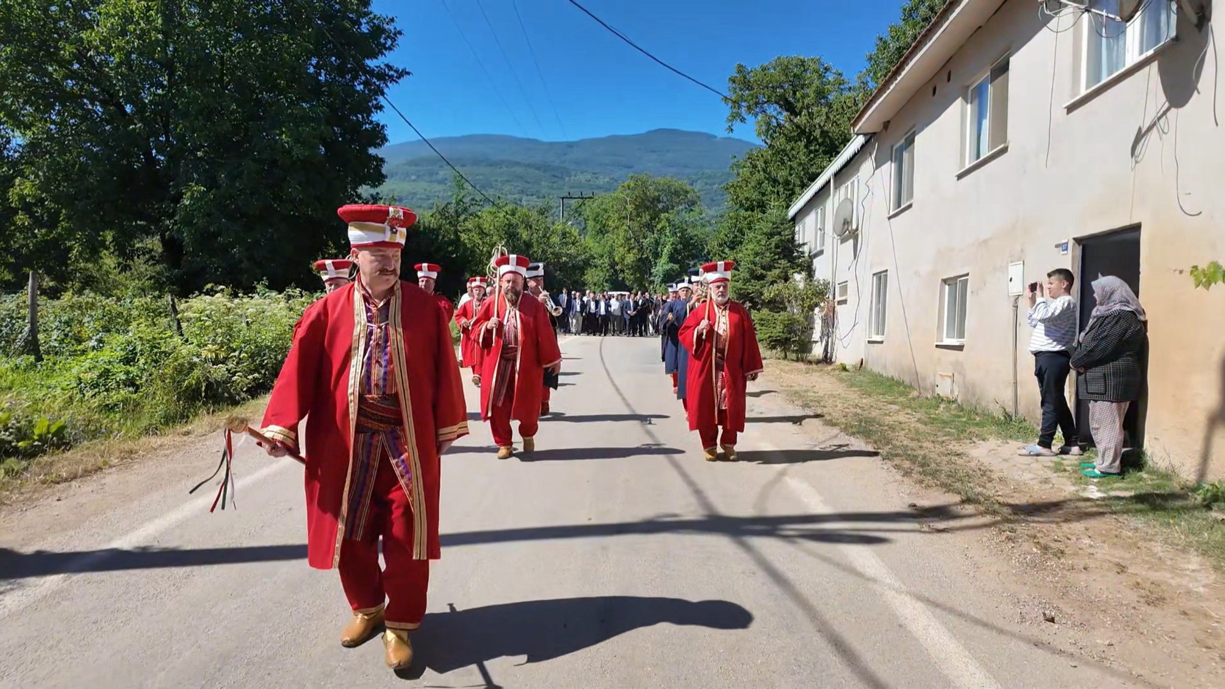 Men in traditional attire leave the village as women take charge for a day under a centuries-old tradition, Bursa, Türkiye, July 13, 2026. (DHA Photo) 