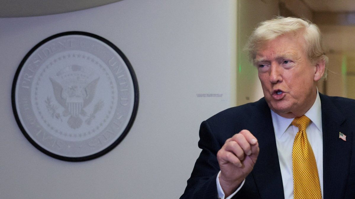 U.S. President Donald Trump speaks to reporters mid-flight in the press cabin of the new Air Force One over Mildenhall, U.K., July 8, 2026. (Reuters Photo)