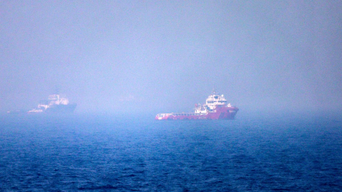 Ships sail near the Strait of Hormuz off the eastern coast of the United Arab Emirates, July 13, 2026. (AFP Photo)