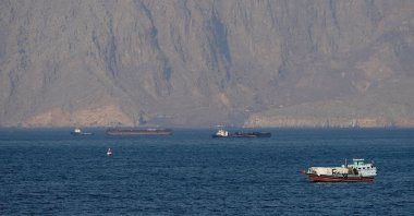 Ships and tankers in the Strait of Hormuz off the coast of Musandam, Oman, April 18, 2026. (Reuters Photo)