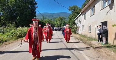 Men in traditional attire leave the village as women take charge for a day under a centuries-old tradition, Bursa, Türkiye, July 13, 2026. (DHA Photo) 
