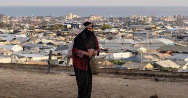 A displaced Palestinian arrives to collect water from the Ita charitable water station, amid ongoing water shortages and limited access to water sources, in Khan Younis, Gaza Strip, Palestine, July 13, 2026. (EPA Photo)