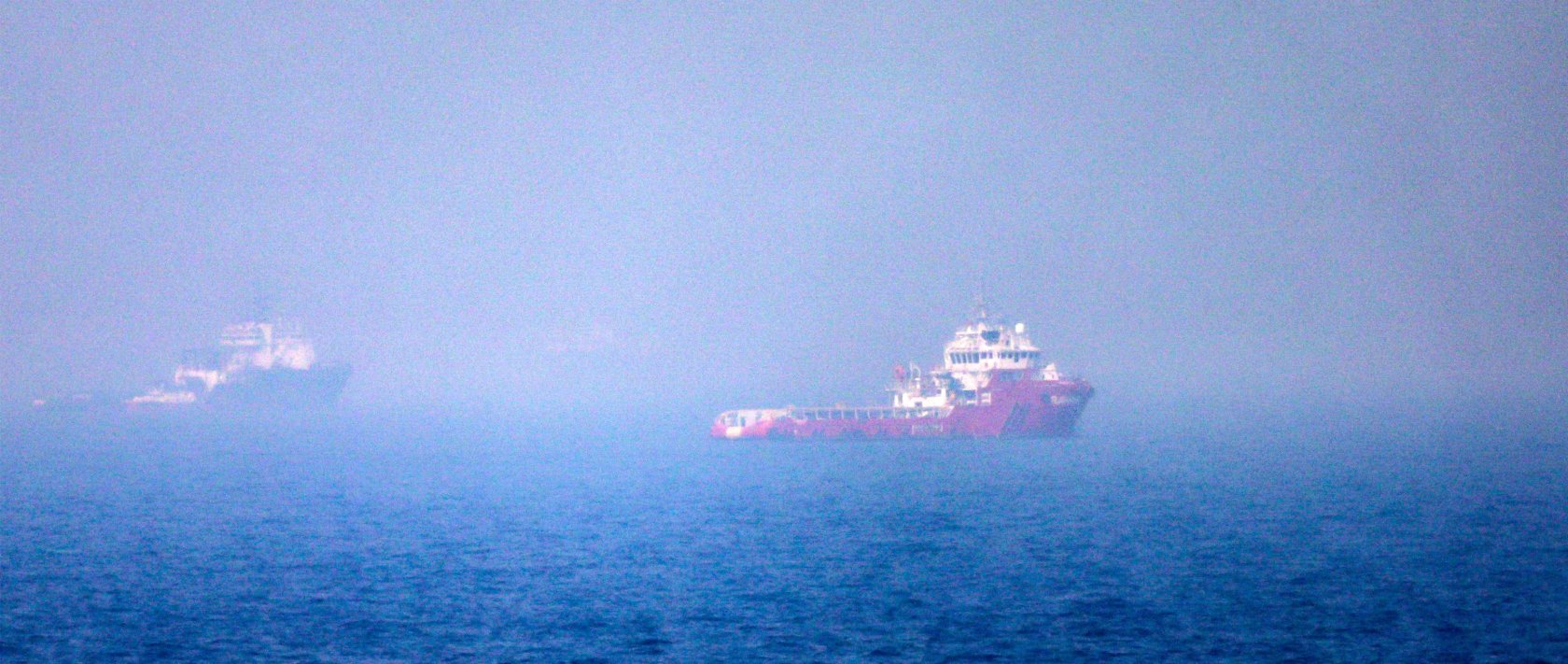 Ships sail near the Strait of Hormuz off the eastern coast of the United Arab Emirates, July 13, 2026. (AFP Photo)