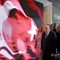 MHP leader Devlet Bahçeli (C) visits an exhibition at Parliament, Ankara, Türkiye, July 14, 2026. (AA Photo)