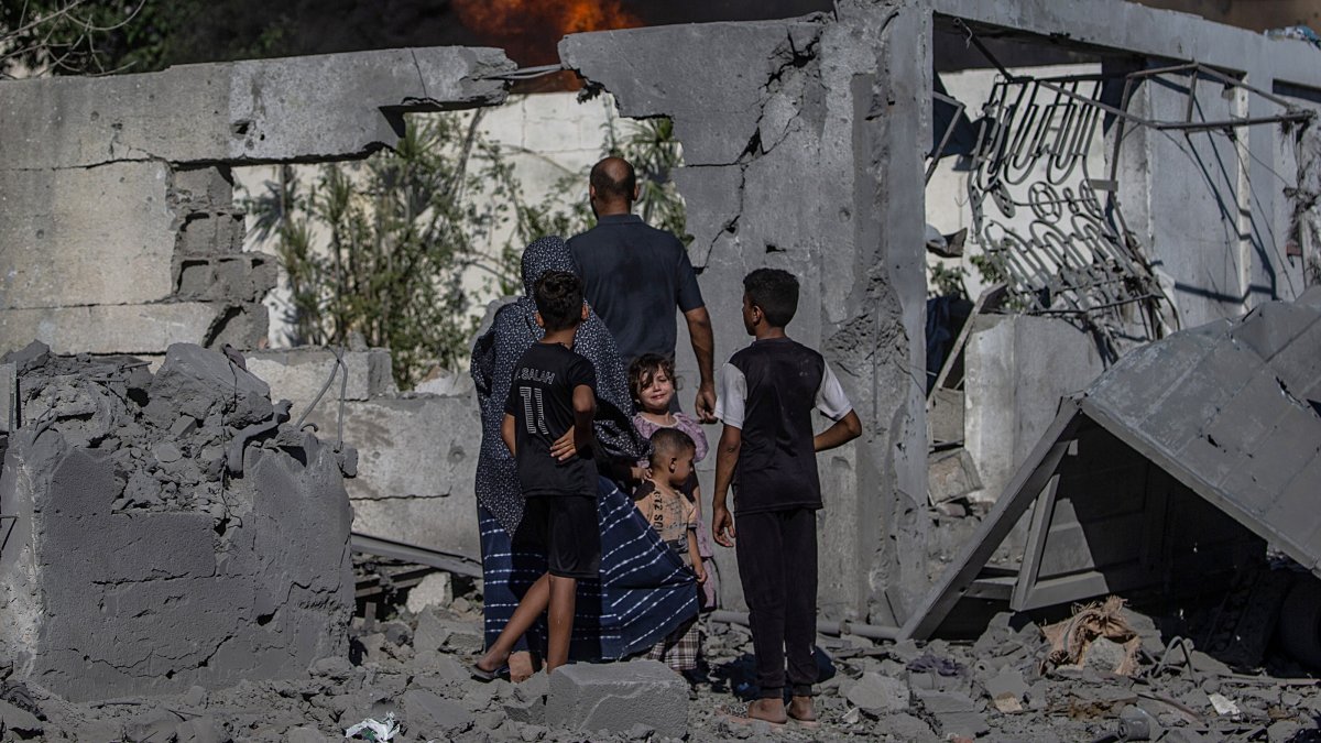 A Palestinian family stands next to their destroyed house following an Israeli airstrike in southern Gaza City, Palestine, July 12, 2026. (EPA Photo)