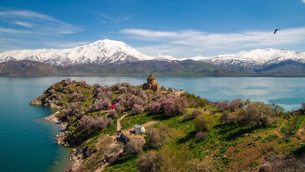 An undated view of an historical church and blooming trees on the shores of Lake Van, Van, Türkiye. (Shutterstock Photo)