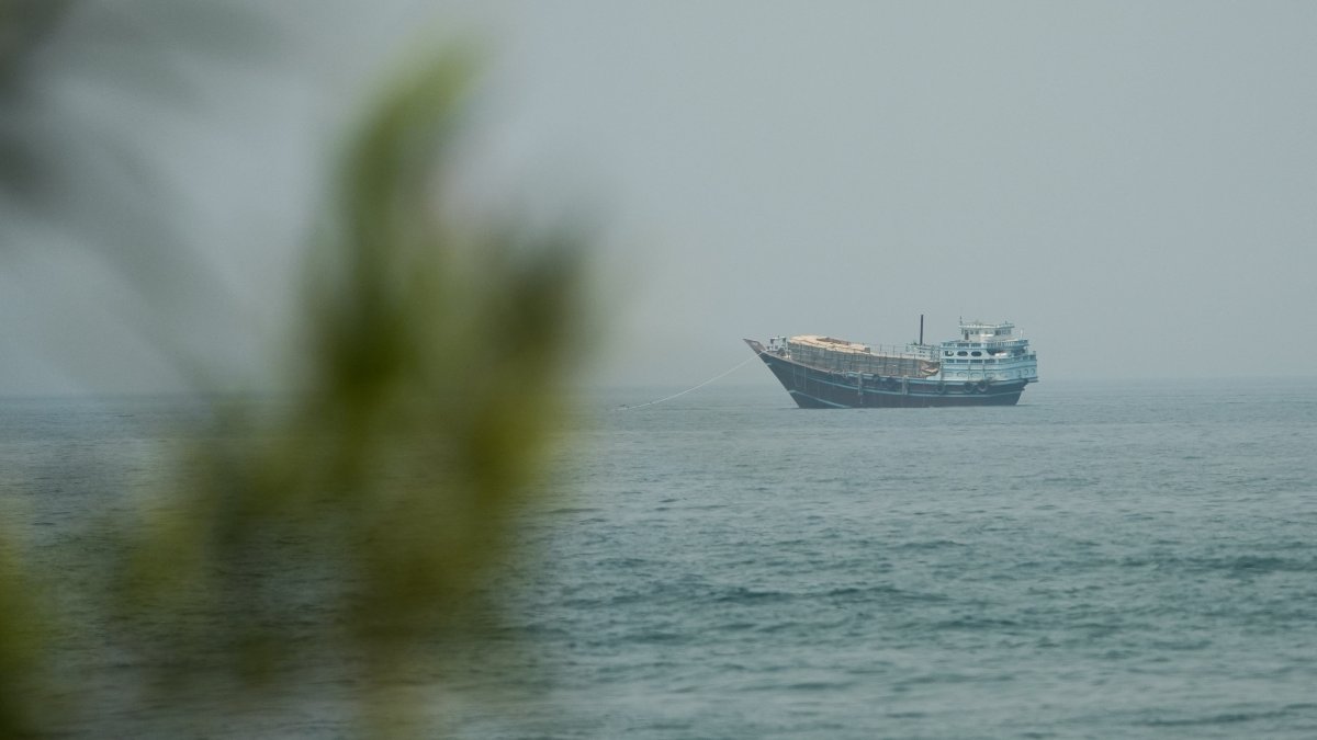 A vessel waits in the Strait of Hormuz, as seen from Musandam, Oman, July 14, 2026. (Reuters Photo)