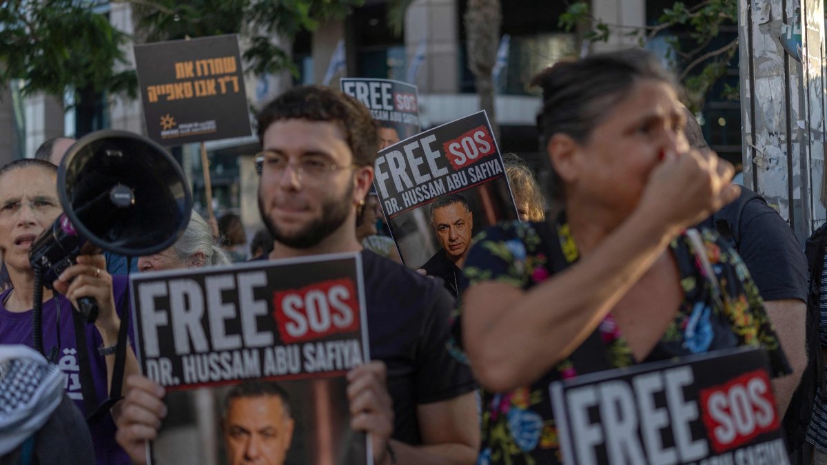 Israeli activists hold placards and chant slogans calling for the release of Palestinian Gaza Doctor Hussan Abu Safiya, in Tel Aviv, Israel, July 6, 2026. (AFP Photo)