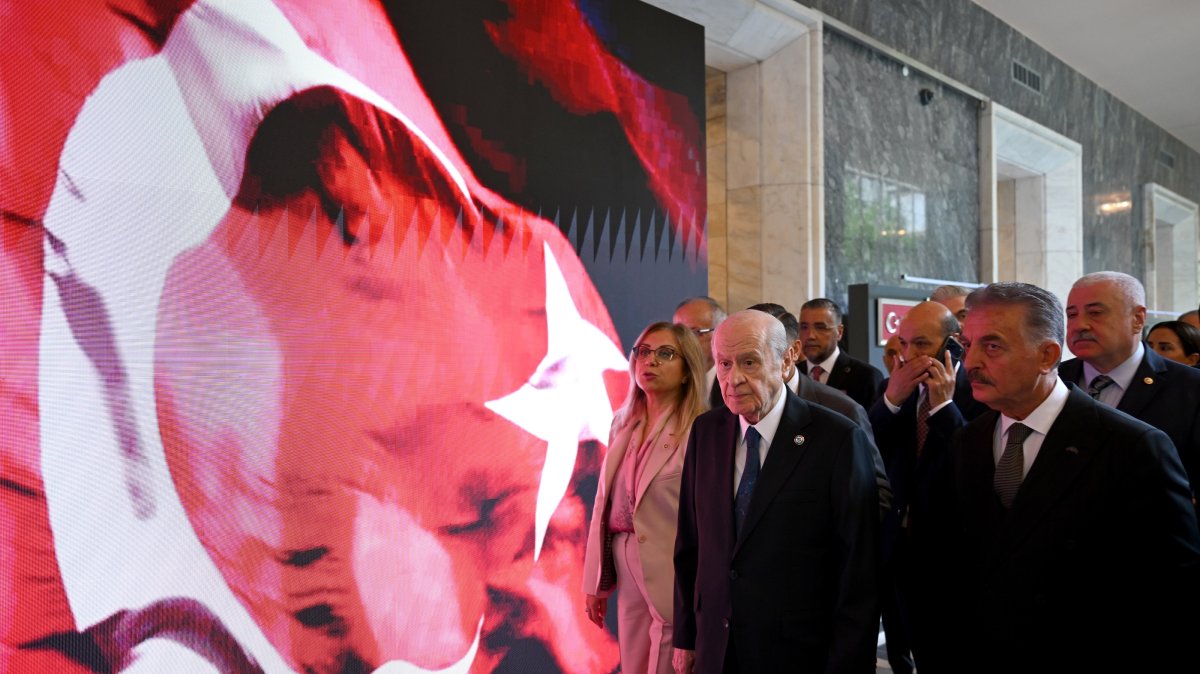 MHP leader Devlet Bahçeli (C) visits an exhibition at Parliament, Ankara, Türkiye, July 14, 2026. (AA Photo)